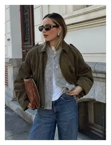Details of the stylish women suede bomber jacket paired with knit cardigan for casual daily wear.