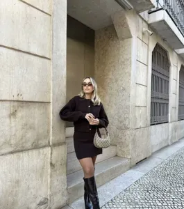 European style brown knit cardigan and high waist skirt set detail view, chic fashion outfit.