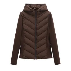 Women's slim-fit hooded lightweight puffer jacket with knitted long sleeves in dark brown.