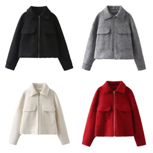 Detailed view of the stylish wool-blend lapel zip jacket featuring dual chest pockets and crop cut.