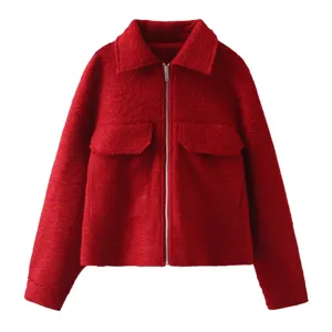 Red textured zip jacket detail shot showing collar and pocket craftsmanship clearly.