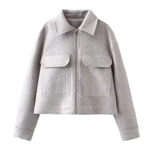 Grey wool blend cropped jacket detail, zipper closure, lapel collar and dual flap pockets.