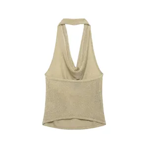 Metallic knit halter top detail, cowl neck sleeveless design, shimmering fabric surface.