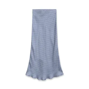 Detailed view of the blue satin polka dot midi skirt, showcasing the smooth texture and drape.