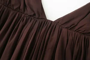 Brown camisole top with deep V-neck and stylish pleated details for summer fashion style.