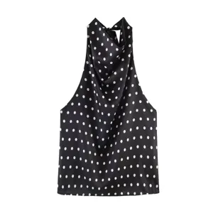 Elegante top halter de lunares en blanco y negro con elegante cuello drapeado.