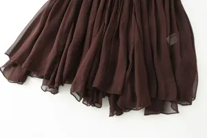 Close-up detail of the stylish brown ruffled hem on a chic summer fashion women camisole top.