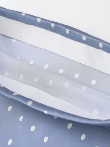 Detailed shot of women high waist polka dot satin midi skirt elastic waistband design.