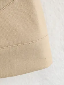 Detailed view of the stylish khaki twill fabric and delicate stitching for women jackets.