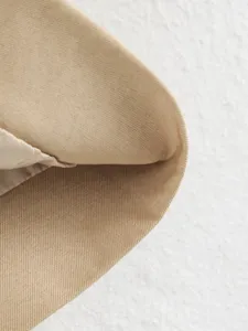 Close-up detail view of the stylish women's jacket fabric showcasing premium khaki twill texture.