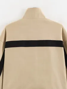 Detailed back view of women beige stand-up collar jacket with black contrast stripe.