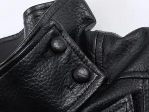 Black leather jacket close-up detail shot, featuring textured fabric and button design.
