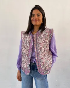 Women vintage floral quilted vest, ethnic style sleeveless padded outerwear detail view.