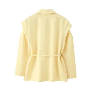 Back detail of women yellow blazer with padded shoulders and waist belt for autumn style