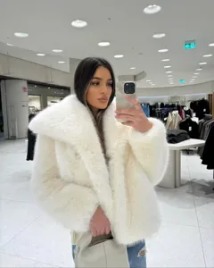 Detailed view of women's fluffy faux fur coat, soft texture and wide lapel design in winter.