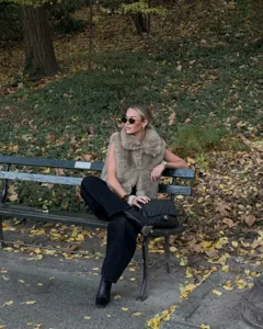 Street style faux fur vest detail, perfect autumn outdoor fashion look for women wear.