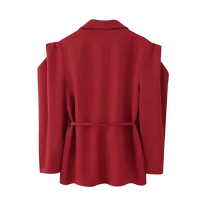 Back view detail of women red blazer jacket showing padded shoulders and slim waist belt.