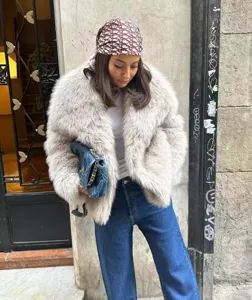 Stylish short faux fur coat for women, fluffy and warm winter outerwear jacket.