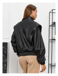 Detail view of black PU leather jacket with retro oversized shoulder design and zip.