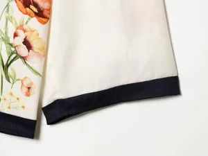 Floral print fabric detail with contrast dark blue cuff hem for women daily wear.