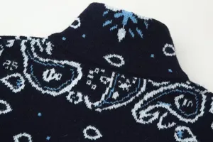 Close-up detail of women's vintage paisley jacquard knit cardigan collar and texture.