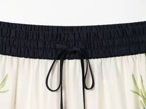 Waistband detail shot of women's floral casual trousers with elastic waist and adjustable drawstring.