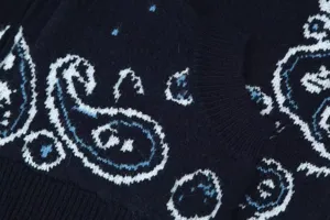 Close-up detail of American retro jacquard knit cardigan with classic paisley pattern.