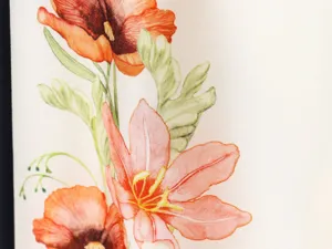 Detailed view of the French vintage floral printed fabric with vibrant orange and green motifs.