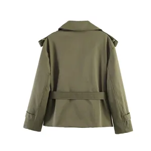 Back view detail of khaki short trench coat featuring waist belt and lapel collar design.