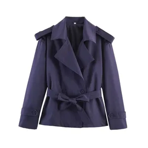 Short women trench coat detail featuring classic lapel collar, elegant belt, and stylish epaulets.