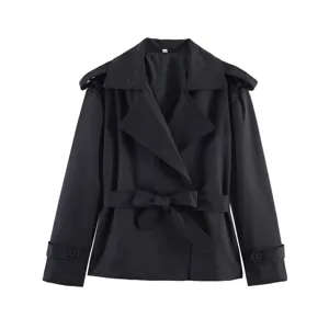 Detailed view of women's black short trench coat, classic lapel, elegant belted design.