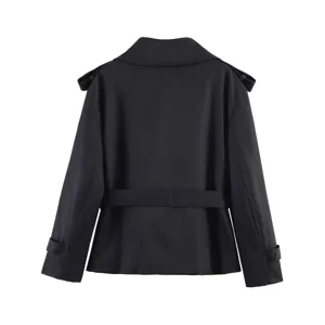 Detail view of back design of women's short black trench coat with waist belt and collar.