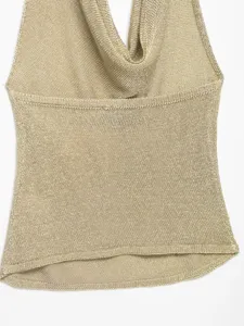 Metallic knit halter top detail view, shimmering gold texture, sleeveless cowl neck design.