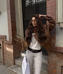 Chic polka dot two-piece outfit detail, elegant spring summer casual wear for women.
