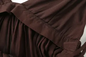 Close-up detail of women's dark brown pleated camisole top featuring neat stitching and soft fabric.