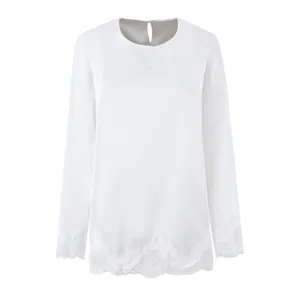 White long sleeve detail blouse with delicate lace trim on cuffs and hem for elegant daily wear.
