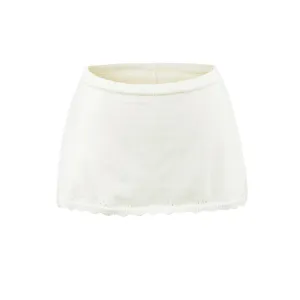 Detailed view of the off-white knitted waist wrap featuring a ribbed top and scalloped eyelet hem.