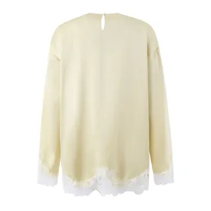 Exquisite lace trim long sleeve top featuring a chic keyhole back design and smooth fabric.