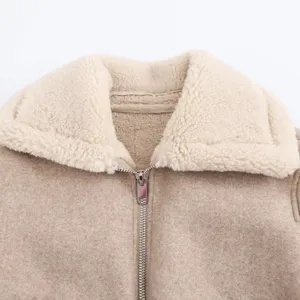 Detailed view of the women lapel jacket collar, soft fleece inner lining, metal zipper trim.