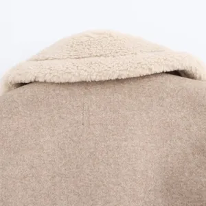 Close-up detail view of the back of women lapel wool jacket, stylish textured fabric design.