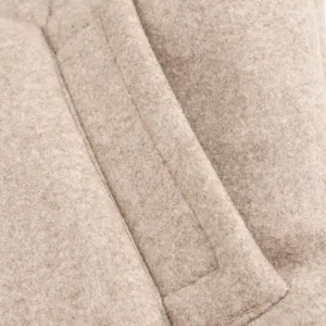 Wool blend jacket fabric texture close-up detail, elegant beige lapel sewing craft view