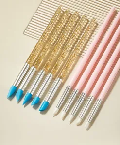 Silicone nail art brush set for painting, sculpting, and modeling with clear and pink handles.