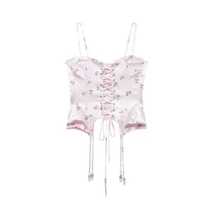 Pink floral corset top for women, featuring lace-up front, spaghetti straps and irregular hem.