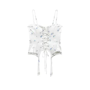 White floral corset camisole detail showing lace-up back and satin fabric finish.
