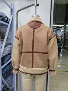 Back view detail of women's brown faux suede and shearling biker jacket with paneling design.