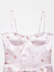 Detailed view of a pink satin floral corset camisole top featuring delicate rose prints.