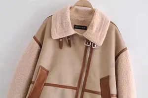Detailed view of women's faux shearling suede biker jacket with cozy lapel collar and zipper.