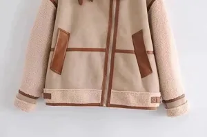 Women casual faux shearling biker jacket with contrast leather piping and cozy fleece detail.