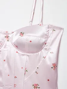Pink floral satin corset top detail, chic spaghetti straps and structured fishbone bustier.