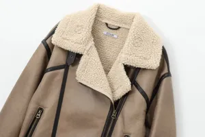Close-up detail of women brown faux leather shearling biker jacket with plush lapel and zip.